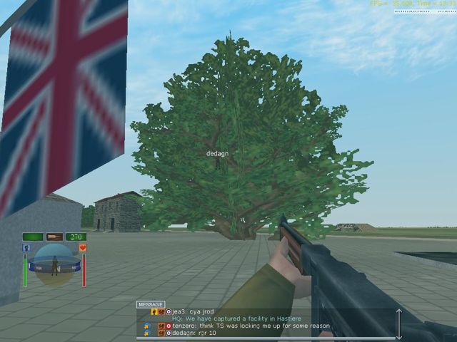 In-game screenshot: Dedagn in a tree by a Union Jack at Hastiere