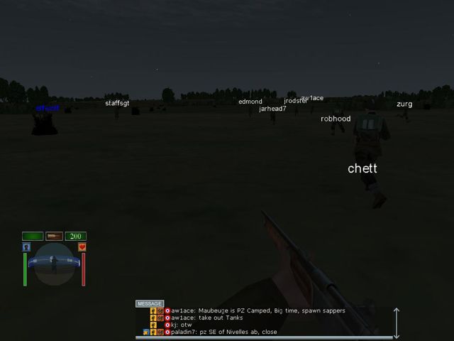 Night in-game screenshot: 3CD squad mates advancing across a field toward Maubeuge